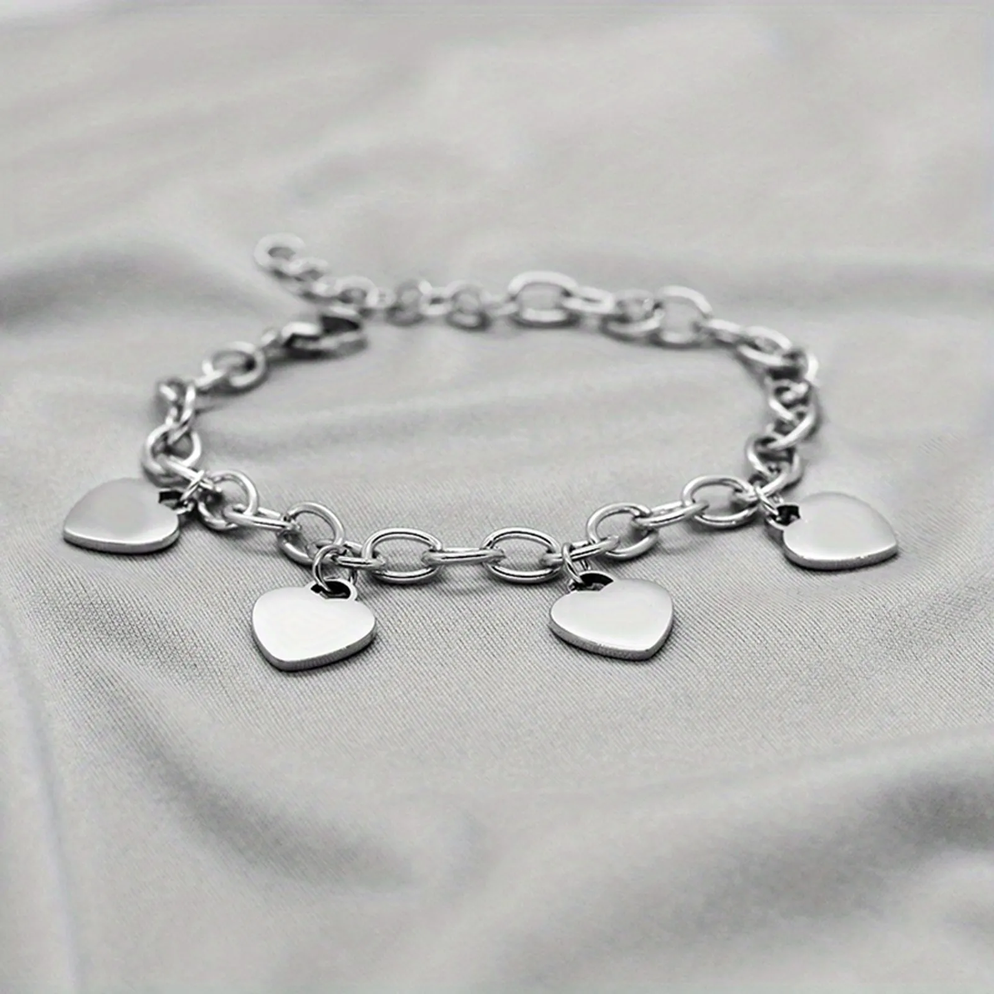 BRACCIALE 4 CUORI ACCIAIO