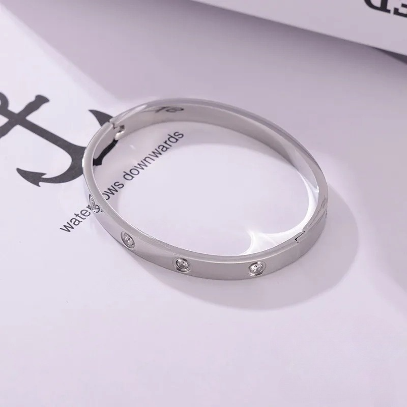 BRACCIALE RIGIDO PUNTI LUCE ACCIAIO